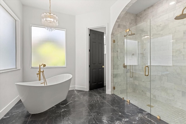 619 Largovista Dr, Oakland, FL 34787 - bathroom with a soaking tub, a stall shower, marble tiled flooring, and healthy amount of natural light