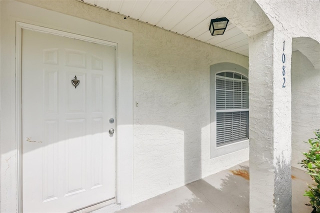 1082 Worthington Dr, Deltona, FL 32738 - view of exterior entry with stucco siding