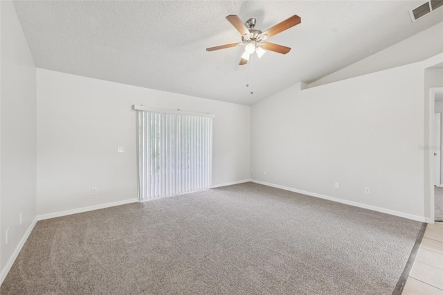 1082 Worthington Dr, Deltona, FL 32738 - empty room with a ceiling fan, vaulted ceiling, light colored carpet, a textured ceiling, and light tile patterned floors