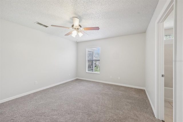1082 Worthington Dr, Deltona, FL 32738 - spare room featuring ceiling fan, carpet, and a textured ceiling