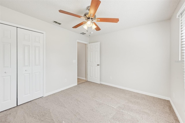 1082 Worthington Dr, Deltona, FL 32738 - unfurnished bedroom featuring carpet, a closet, and a ceiling fan