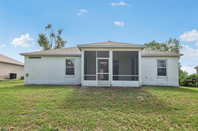 1082 Worthington Dr, Deltona, FL 32738 - back of property with a yard, a sunroom, and roof with shingles