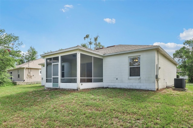 1082 Worthington Dr, Deltona, FL 32738 - rear view of property with a sunroom, a lawn, and roof with shingles