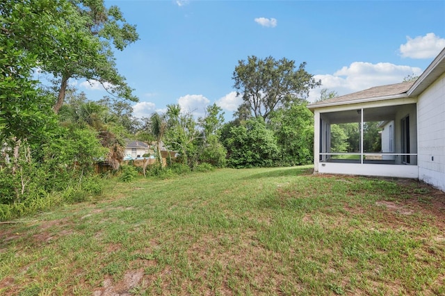 1082 Worthington Dr, Deltona, FL 32738 - view of grassy yard with a sunroom