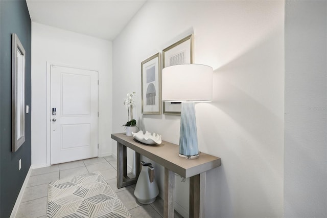 1275 Normandy Dr, Haines City, FL 33844 - doorway to outside with light tile patterned floors and baseboards