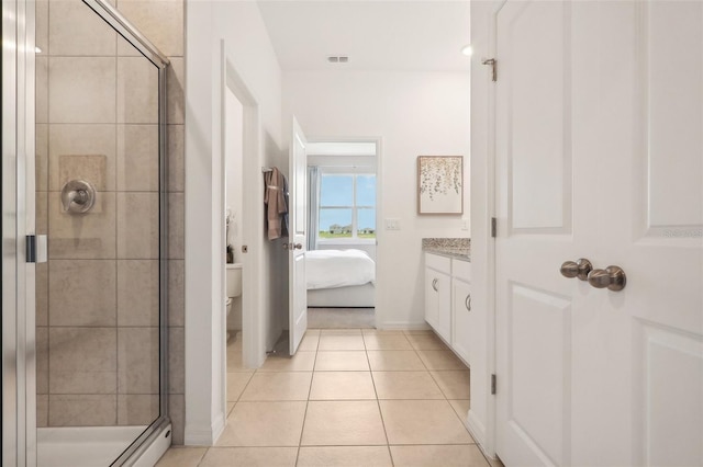 1275 Normandy Dr, Haines City, FL 33844 - full bath with a stall shower, tile patterned floors, vanity, and connected bathroom