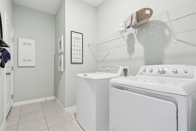 1275 Normandy Dr, Haines City, FL 33844 - washroom featuring washing machine and dryer and light tile patterned flooring
