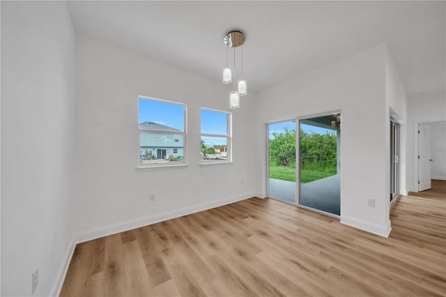 9333 Hialeah Ter, Port Charlotte, FL 33981 - empty room with light wood finished floors and baseboards