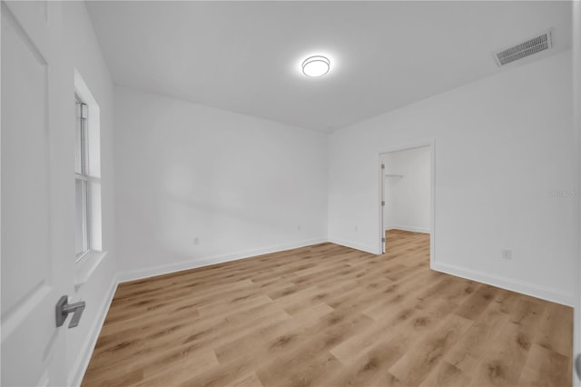 9333 Hialeah Ter, Port Charlotte, FL 33981 - spare room featuring light wood-type flooring and baseboards