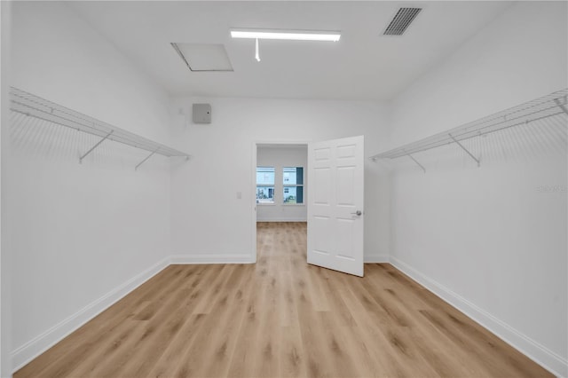 9333 Hialeah Ter, Port Charlotte, FL 33981 - spacious closet with light wood-type flooring and attic access