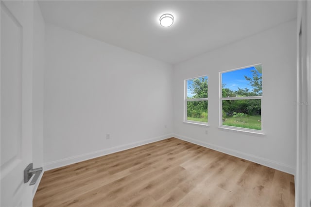 9333 Hialeah Ter, Port Charlotte, FL 33981 - spare room with baseboards and light wood-style flooring