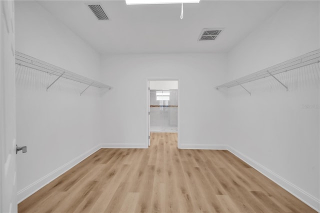9333 Hialeah Ter, Port Charlotte, FL 33981 - walk in closet featuring light wood-type flooring