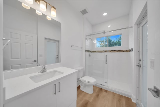 9333 Hialeah Ter, Port Charlotte, FL 33981 - full bath with a stall shower, vanity, wood finished floors, and recessed lighting