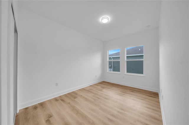 9333 Hialeah Ter, Port Charlotte, FL 33981 - empty room with light wood finished floors and baseboards