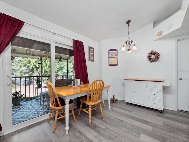5421 Lake Margaret Dr Unit 178, Orlando, FL 32812 - dining room with light wood finished floors and a chandelier