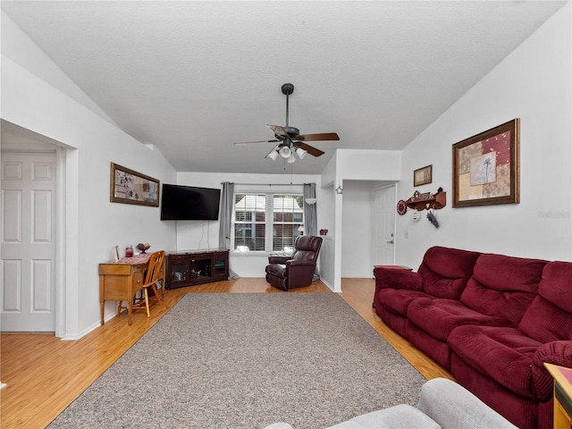 5421 Lake Margaret Dr Unit 178, Orlando, FL 32812 - living area with ceiling fan, light wood finished floors, vaulted ceiling, and a textured ceiling