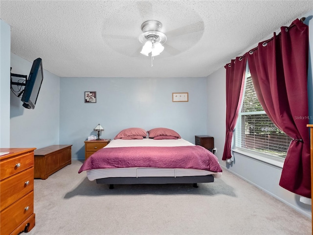 5421 Lake Margaret Dr Unit 178, Orlando, FL 32812 - bedroom featuring light colored carpet, a textured ceiling, and a ceiling fan