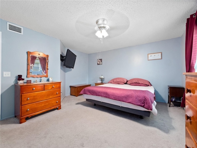 5421 Lake Margaret Dr Unit 178, Orlando, FL 32812 - bedroom with carpet floors, a textured ceiling, and a ceiling fan