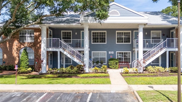 5421 Lake Margaret Dr Unit 178, Orlando, FL 32812 - view of property featuring stairs and uncovered parking