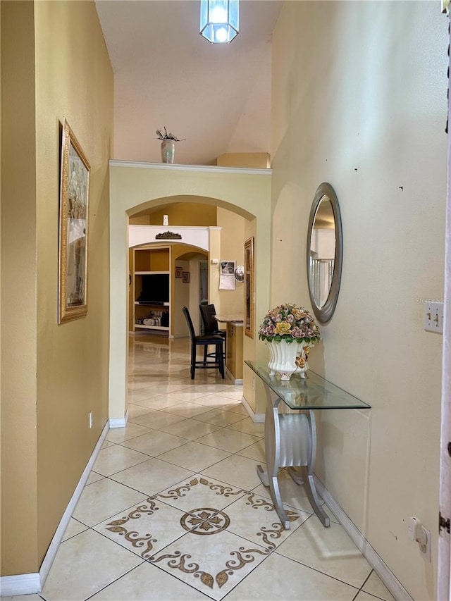 1945 Torrey Dr, Orlando, FL 32818 - corridor with arched walkways, light tile patterned floors, and high vaulted ceiling