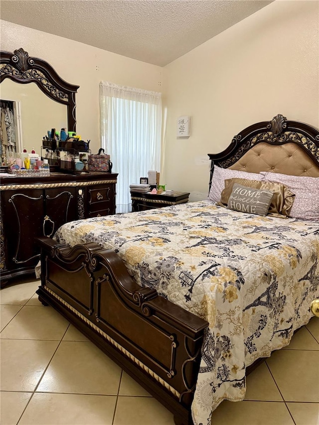 1945 Torrey Dr, Orlando, FL 32818 - bedroom featuring light tile patterned floors and a textured ceiling