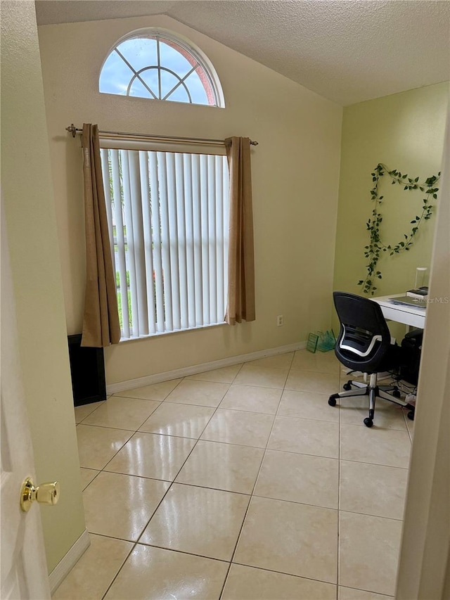 1945 Torrey Dr, Orlando, FL 32818 - unfurnished office featuring tile patterned floors, lofted ceiling, and a textured ceiling