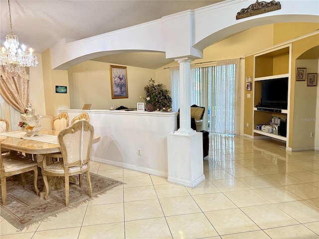 1945 Torrey Dr, Orlando, FL 32818 - tiled dining area featuring arched walkways and a chandelier