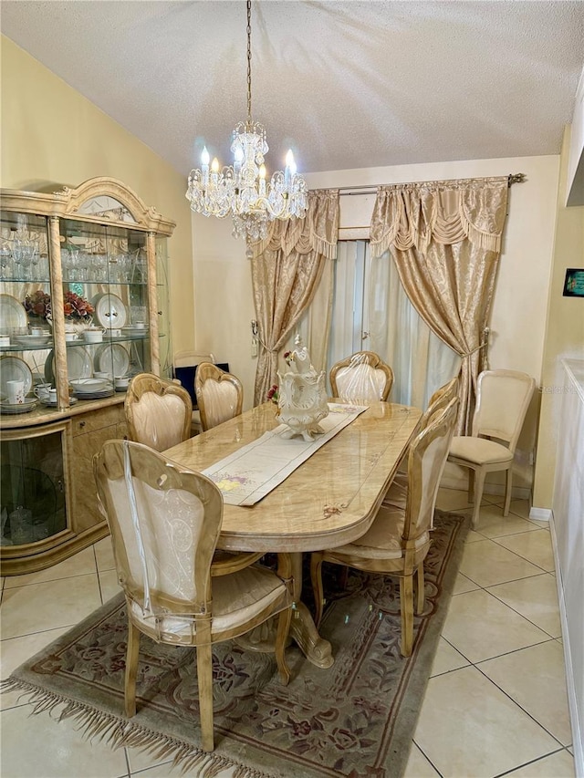 1945 Torrey Dr, Orlando, FL 32818 - dining area with a chandelier, light tile patterned flooring, and a textured ceiling