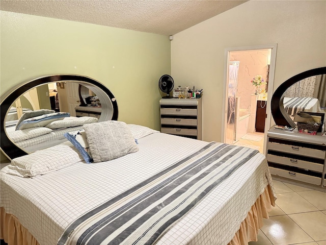1945 Torrey Dr, Orlando, FL 32818 - bedroom featuring light tile patterned flooring, a textured ceiling, and connected bathroom