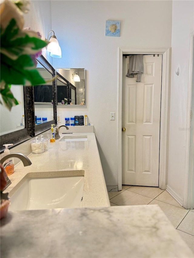 1945 Torrey Dr, Orlando, FL 32818 - bathroom featuring tile patterned floors and double vanity