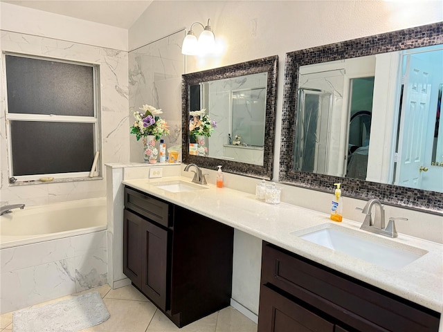 1945 Torrey Dr, Orlando, FL 32818 - bathroom featuring double vanity, a bath, tile patterned flooring, and a shower