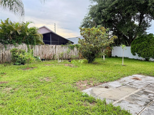 1945 Torrey Dr, Orlando, FL 32818 - fenced backyard featuring a sunroom