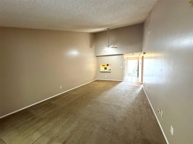 5359 Vineland Rd Unit S, Orlando, FL 32811 - unfurnished room with dark colored carpet, a textured ceiling, ceiling fan, and high vaulted ceiling