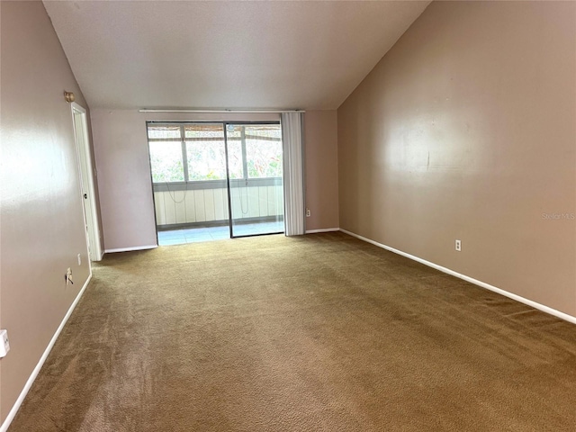 5359 Vineland Rd Unit S, Orlando, FL 32811 - unfurnished room featuring lofted ceiling and carpet floors