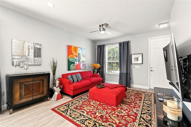 14241 Confetti Dr, Windermere, FL 34786 - living area with wood finished floors and a ceiling fan