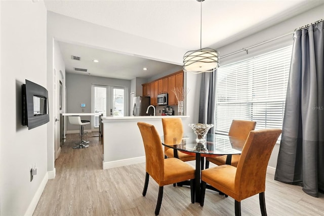 14241 Confetti Dr, Windermere, FL 34786 - dining area featuring light wood-style floors and recessed lighting