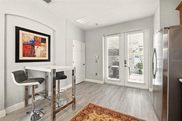 14241 Confetti Dr, Windermere, FL 34786 - entryway with french doors and light wood-style flooring