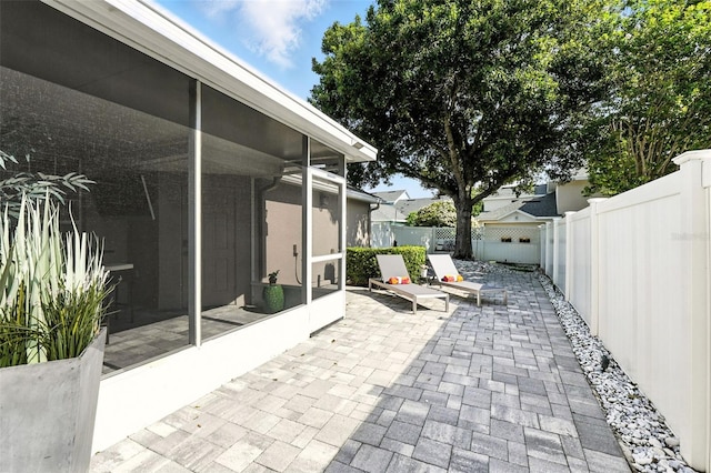 14241 Confetti Dr, Windermere, FL 34786 - fenced backyard featuring a sunroom and a patio