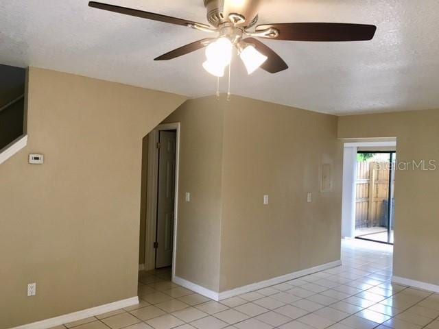 3370 Cedar Springs Pl Unit 156, Winter Park, FL 32792 - empty room featuring light tile patterned floors, a ceiling fan, and a textured ceiling