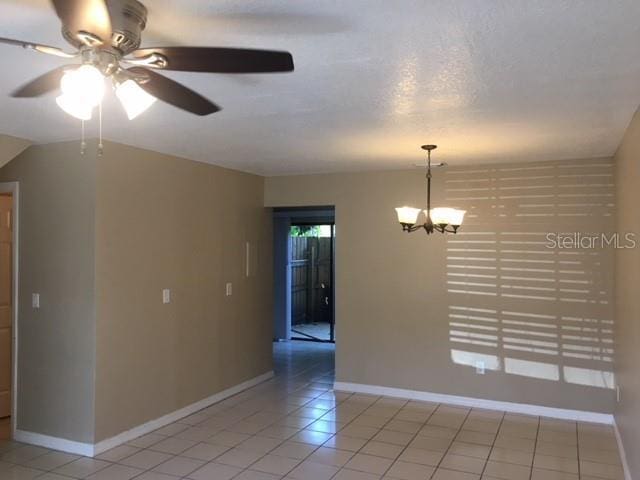 3370 Cedar Springs Pl Unit 156, Winter Park, FL 32792 - empty room featuring ceiling fan, light tile patterned flooring, and a chandelier