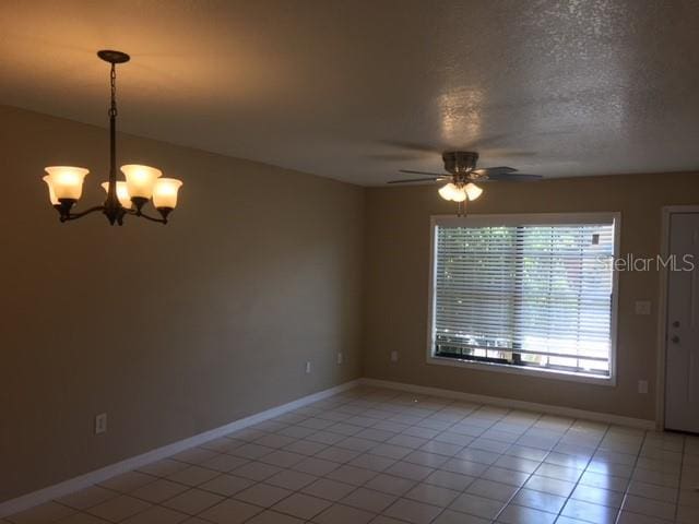 3370 Cedar Springs Pl Unit 156, Winter Park, FL 32792 - unfurnished room featuring light tile patterned floors, a ceiling fan, and a chandelier