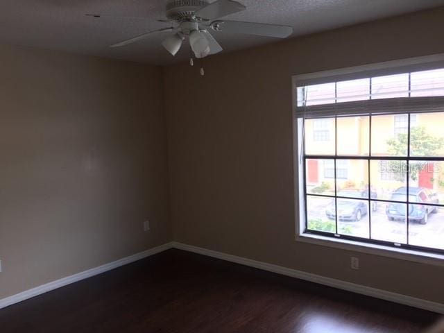 3370 Cedar Springs Pl Unit 156, Winter Park, FL 32792 - spare room featuring dark wood finished floors and a ceiling fan