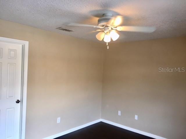 3370 Cedar Springs Pl Unit 156, Winter Park, FL 32792 - spare room featuring a ceiling fan and a textured ceiling