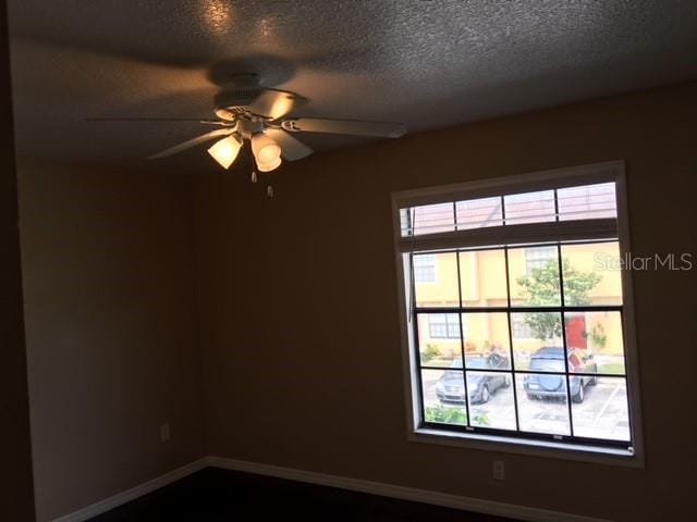 3370 Cedar Springs Pl Unit 156, Winter Park, FL 32792 - unfurnished room featuring a ceiling fan and a textured ceiling