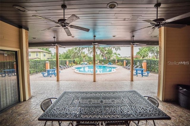 3370 Cedar Springs Pl Unit 156, Winter Park, FL 32792 - view of patio featuring ceiling fan, a community pool, and outdoor dining space