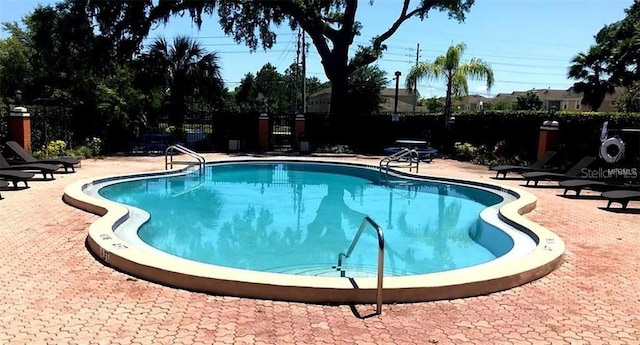 3370 Cedar Springs Pl Unit 156, Winter Park, FL 32792 - community pool featuring a patio area