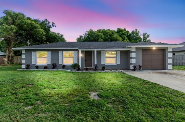 5310 Pineview Way, Apopka, FL 32703 - single story home with an attached garage, driveway, and roof with shingles