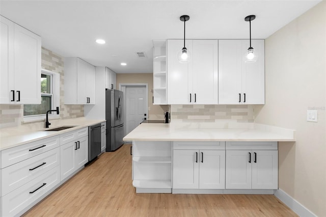 5310 Pineview Way, Apopka, FL 32703 - kitchen featuring open shelves, appliances with stainless steel finishes, white cabinets, decorative backsplash, and light wood finished floors