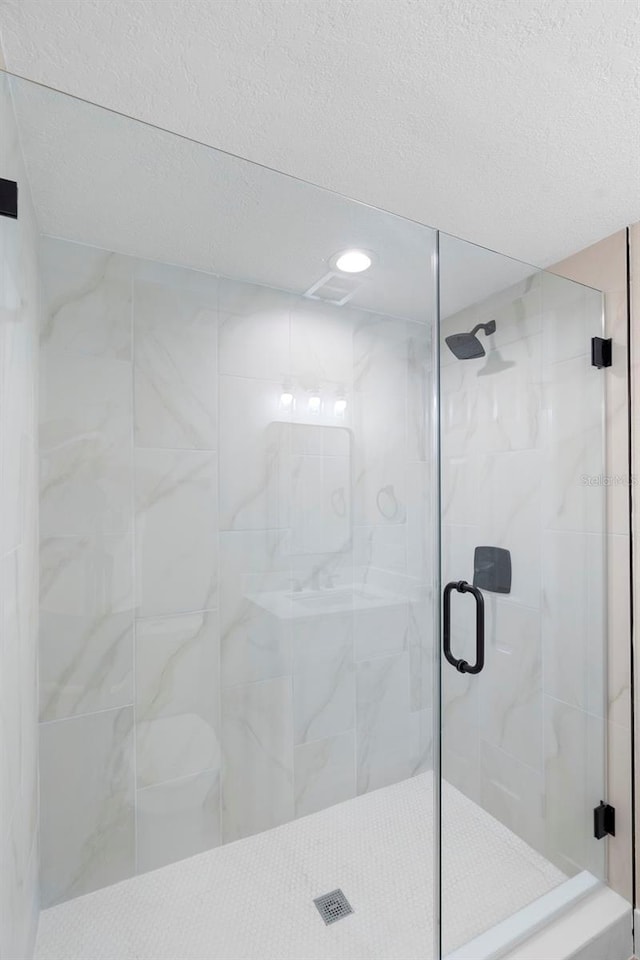 5310 Pineview Way, Apopka, FL 32703 - full bath with a stall shower, a textured ceiling, and recessed lighting
