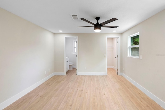 5310 Pineview Way, Apopka, FL 32703 - unfurnished bedroom with a spacious closet, light wood-type flooring, recessed lighting, ensuite bath, and ceiling fan